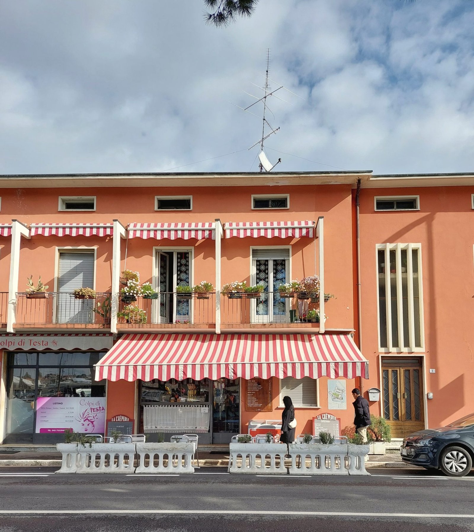 A striped fabric awning over a shopfront.